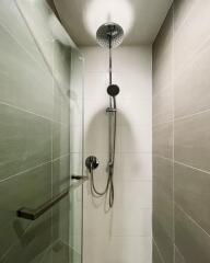 Modern shower area with overhead and handheld showerheads