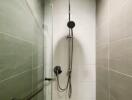 Modern shower area with overhead and handheld showerheads