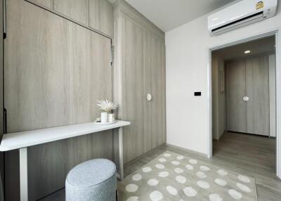 Modern bedroom with wooden paneling and air conditioning