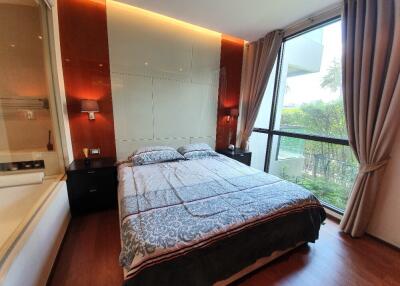 Modern bedroom with large window and natural light