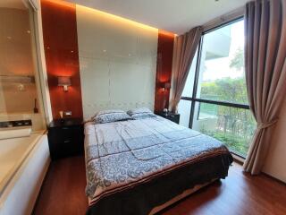 Modern bedroom with large window and natural light