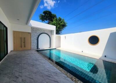 Outdoor area with swimming pool and tiled flooring