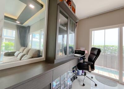 Home office with glass door and modern furniture