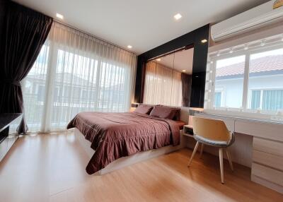 Modern bedroom with large window