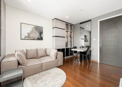 Modern living room with a sofa and dining area