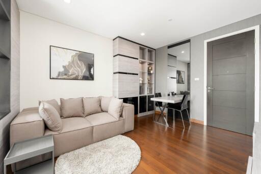 Modern living room with a sofa and dining area