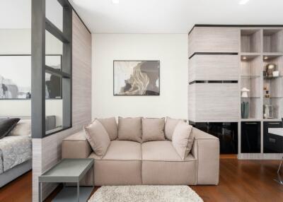 Modern living room with beige sofa and side table