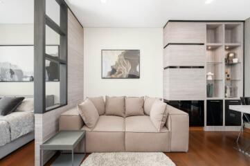 Modern living room with beige sofa and side table