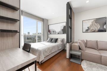 Modern bedroom interior with a view of the city