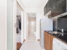 Modern kitchen with appliances and view of bathroom