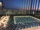 Rooftop pool night view with cityscape