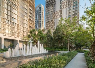 Modern high-rise residential buildings with landscaped garden and water fountain