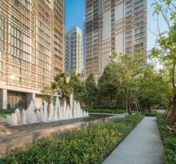 Modern high-rise residential buildings with landscaped garden and water fountain