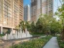 Modern high-rise residential buildings with landscaped garden and water fountain