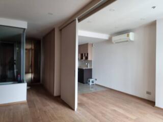 Main living space with hardwood floors and air conditioning