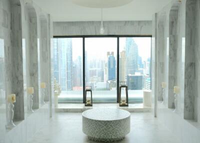 Modern luxury indoor space with marble flooring and city view