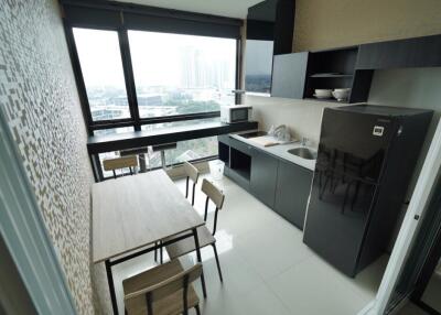 Modern kitchen with large windows and dining table