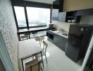 Modern kitchen with large windows and dining table