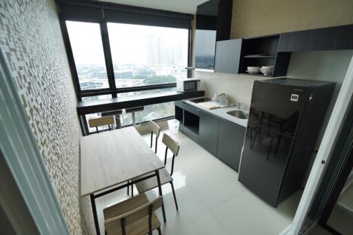 Modern kitchen with large windows and dining table