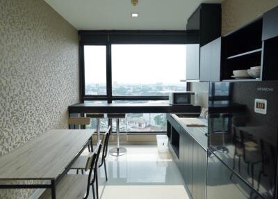 Modern kitchen with dining area and large window