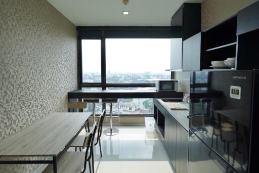 Modern kitchen with dining area and large window