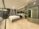 Modern bedroom with double bed and mirrored wardrobes