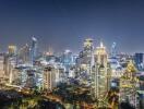 Night view of a modern city skyline with illuminated skyscrapers