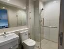 Modern bathroom with a shower area, toilet, and sink