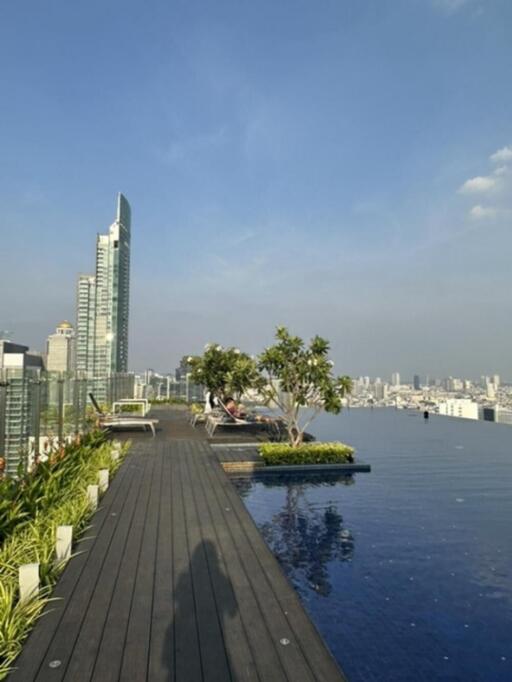 rooftop infinity pool with city skyline view