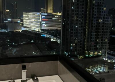 View from the bathroom over a cityscape at night