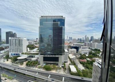 Scenic view of a modern high-rise building with surrounding cityscape