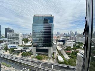 Scenic view of a modern high-rise building with surrounding cityscape