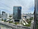 Scenic view of a modern high-rise building with surrounding cityscape