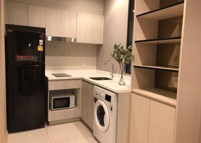 modern kitchen with appliances and shelving