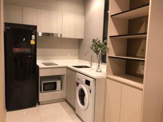 modern kitchen with appliances and shelving