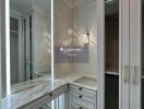 Well-lit dressing room with built-in storage and vanity mirror