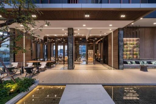 Spacious and modern lobby area with seating and greenery