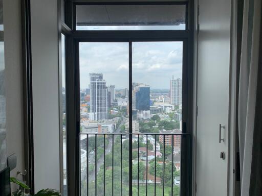 View from a high-rise apartment balcony overlooking the city