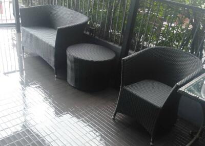 Outdoor balcony with wicker furniture