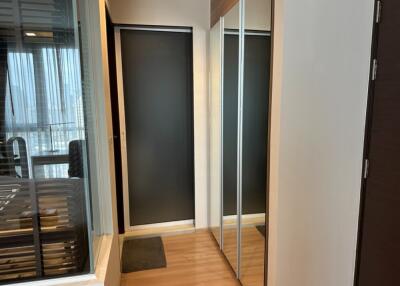 Modern hallway with sliding doors and mirrored closet