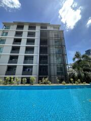 Outdoor view of an apartment building with a swimming pool