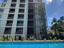 Outdoor view of an apartment building with a swimming pool