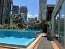 A rooftop pool with a view of skyscrapers