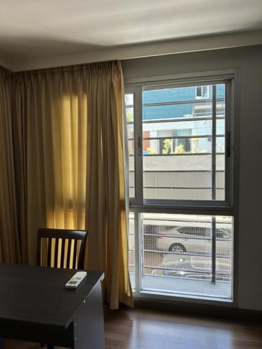 Living room with window and office desk