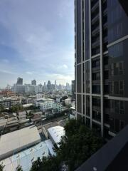 View of cityscape and neighboring building from a high-rise apartment