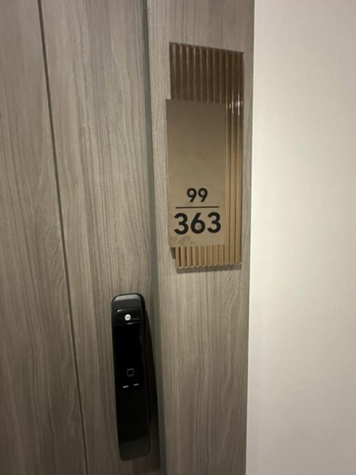 Door with electronic lock and room number 363