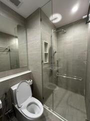 Modern bathroom with glass shower and toilet