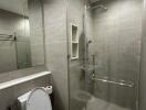 Modern bathroom with glass shower and toilet