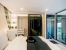 Modern bedroom with large windows and contemporary furnishings