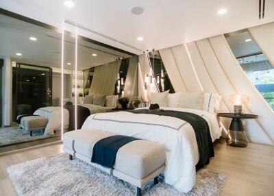 Modern and cozy bedroom with mirrors and elegant decor